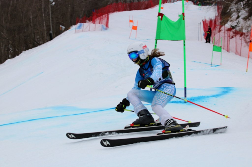 competitive skier racing through down a hill