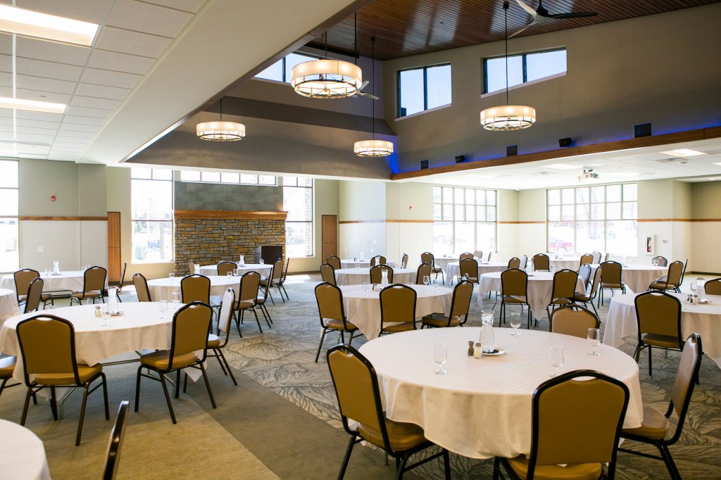 tables set for a meeting with lots of windows for light