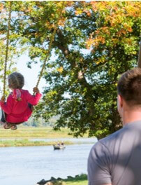 Dad and Daughter Swinging