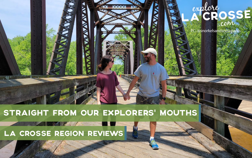 A couple walking along Lytle's Landing Bridge holding hands