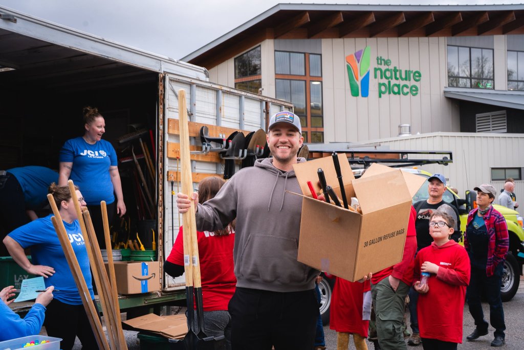 a man holding a box of tools