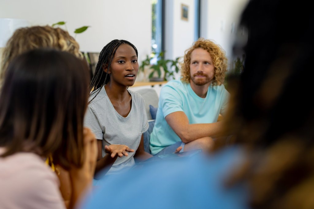 a group of people sitting in a circle