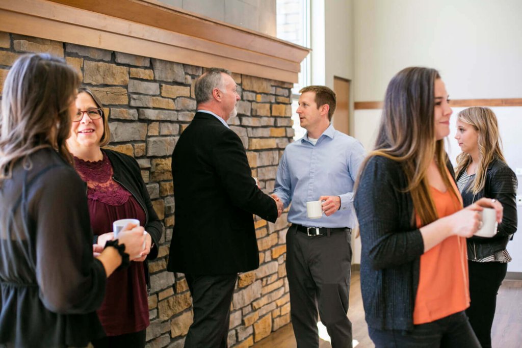 People connect and network during a meeting hosted in beautiful La Crosse, Wisconsin.
