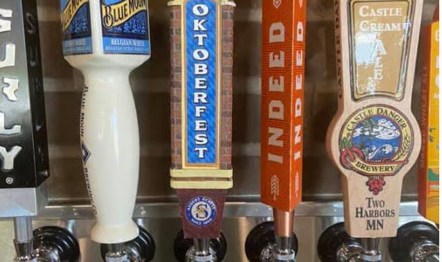 a row of beer taps