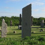 a group of stone sculptures in a field