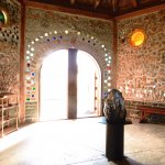 a stone room with a stone wall and a stone pillar