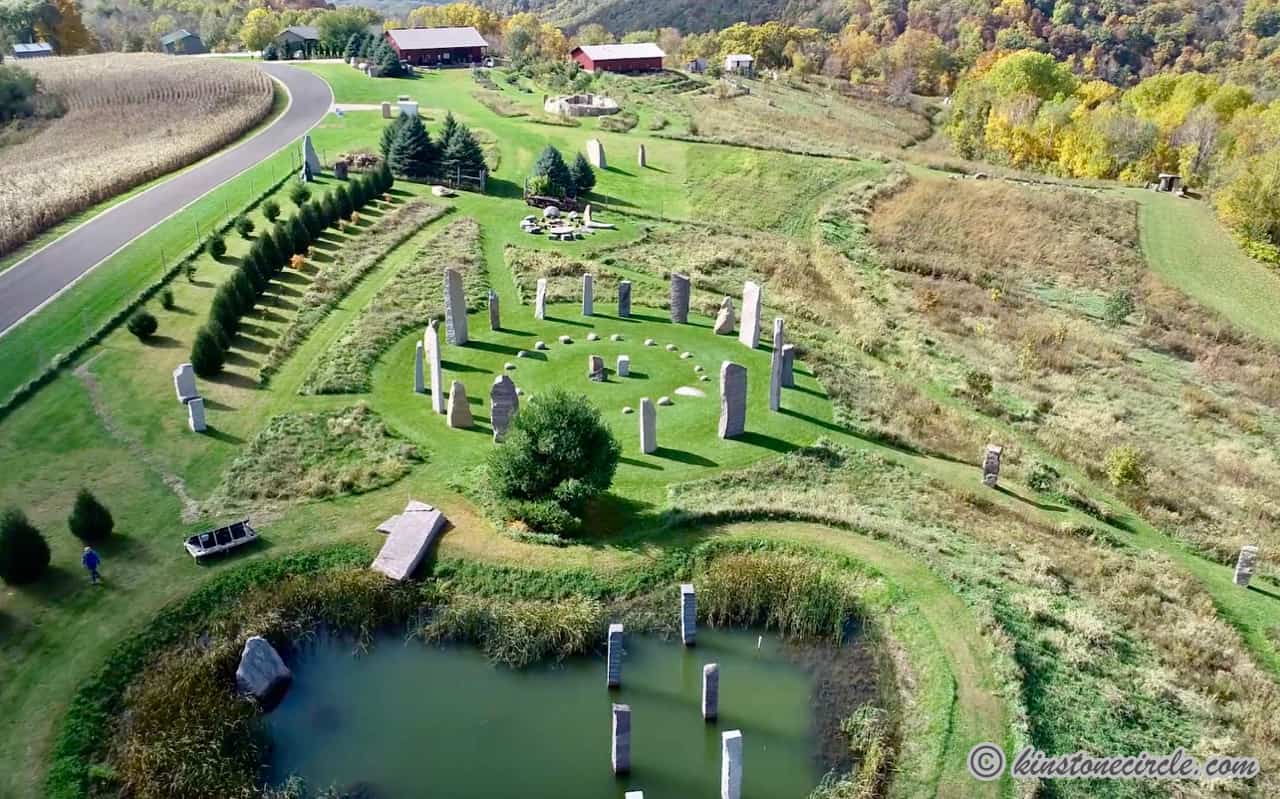 a large stone structure in a grassy area