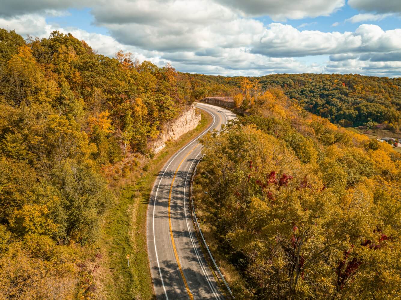 Top Things to Do 14 A highway carves through a hillside that is turning yellow during the fall season in beautiful La Crosse, Wisconsin.
