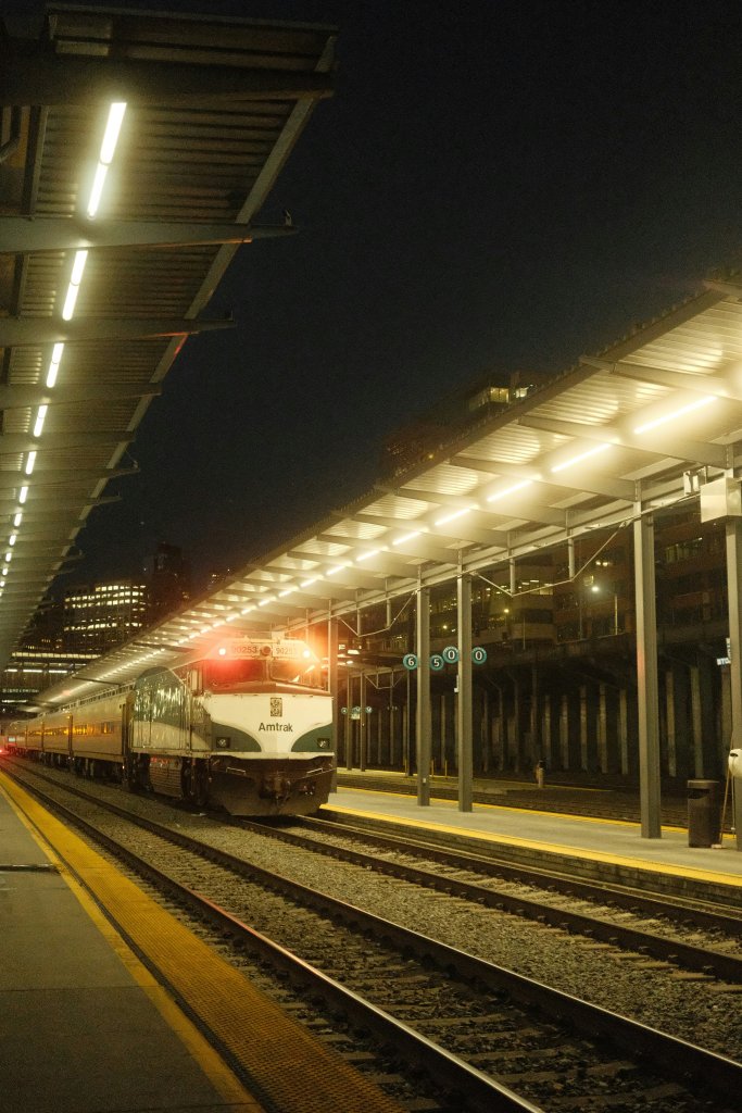 an amtrak train pulls into station underground