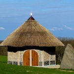a small building with a thatched roof