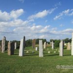 a group of stone pillars in a field