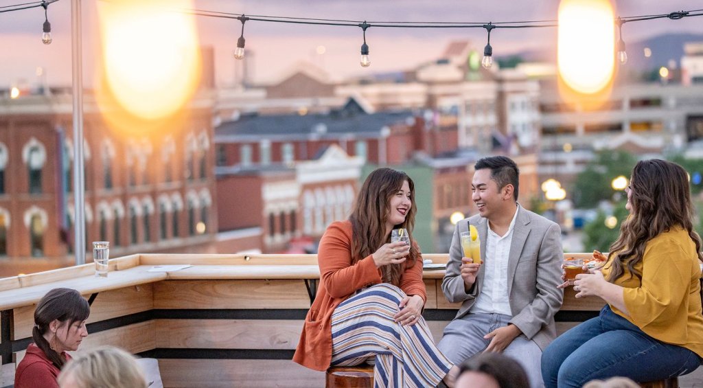 La Crosse Events Calendar 24 people having drinks on a patio at sunset