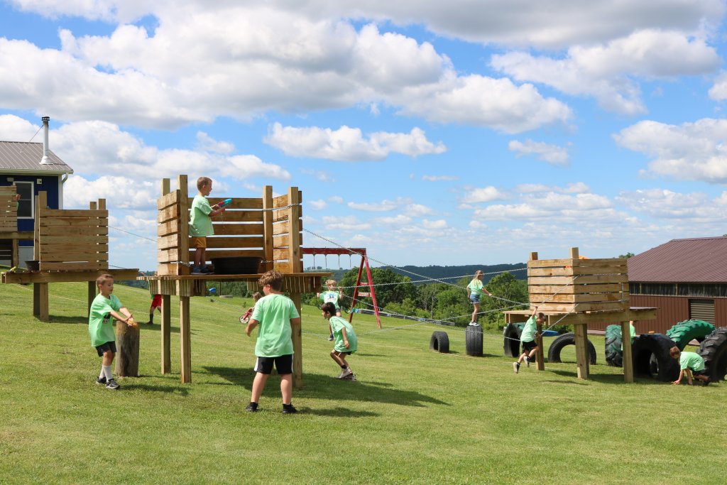 3 Fall Adventures Perfect for Pumpkin Season 4 Kids playing on a playground structure at Hidden Hills