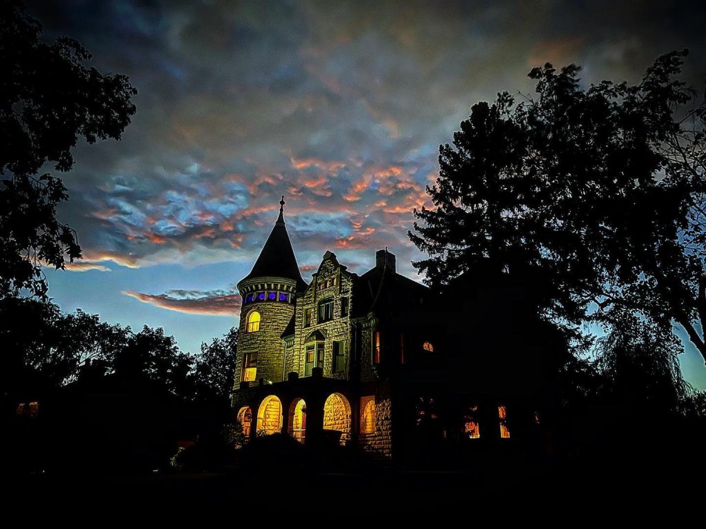 Castle La Crosse at dusk with clouds in the background