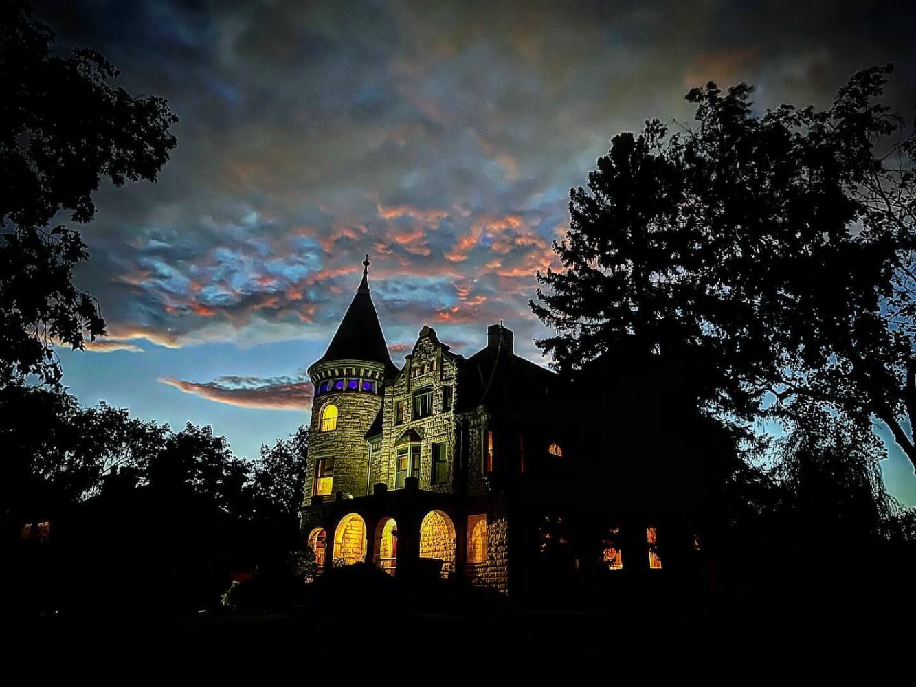 Castle La Crosse at dusk with clouds in the background