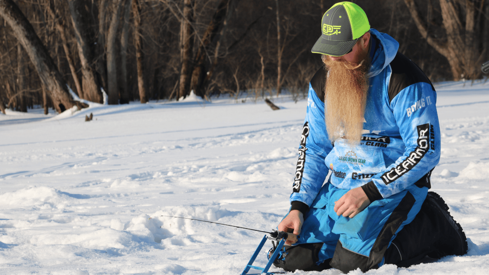 Man ice fishing on the back pools of the Mississippi River in winter