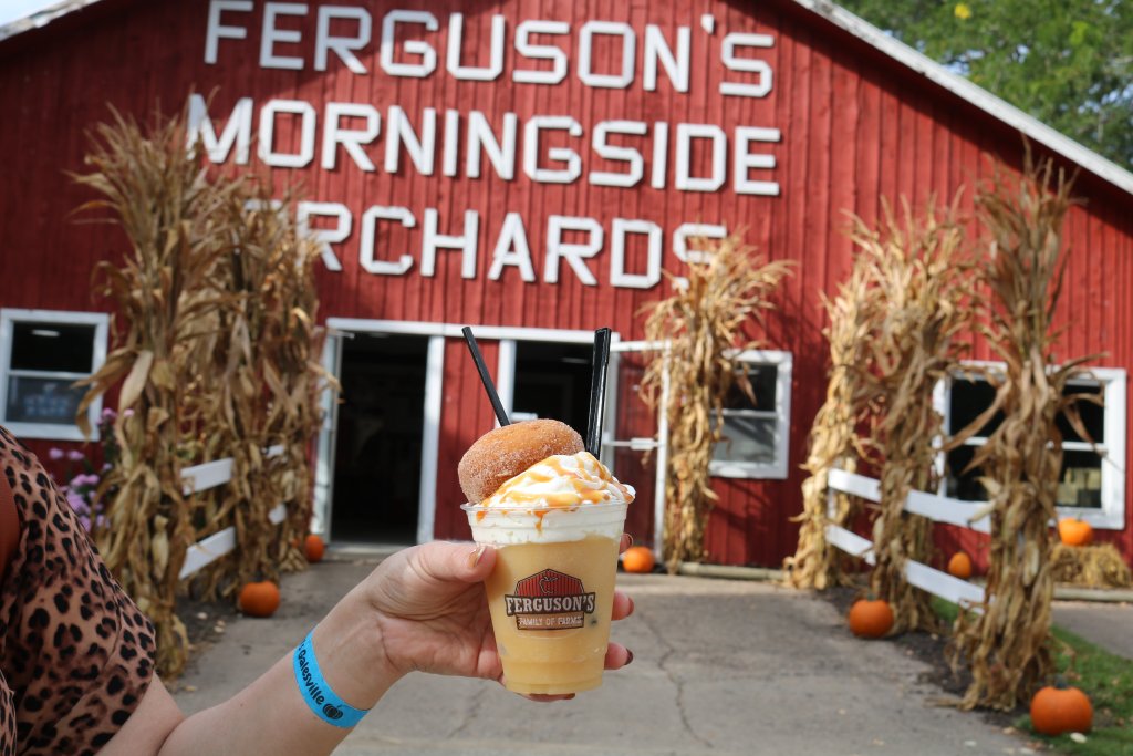 a delicious apple drink in front of the Ferguson's orchard barn