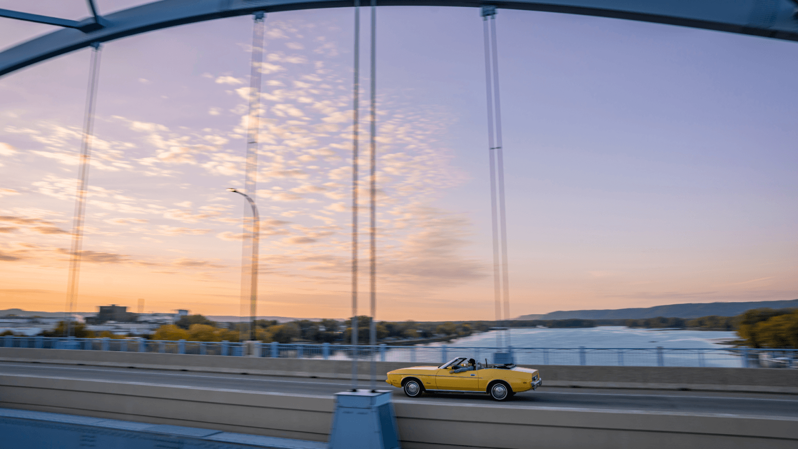Car driving on the Big Blue Bridge