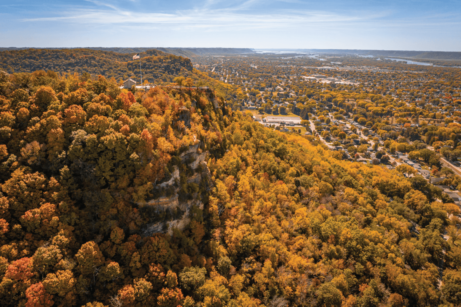 Experience fall in La Crosse, Wisconsin with scenic foliage on Grandad Bluff, Driftless hiking, Great River Road drives, apple orchards, festivals, local flavors, and more.