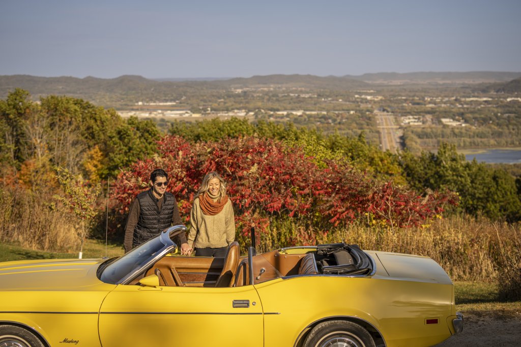 Couple overlooking apple blossom scenic drive in the fall in la crescent, mn