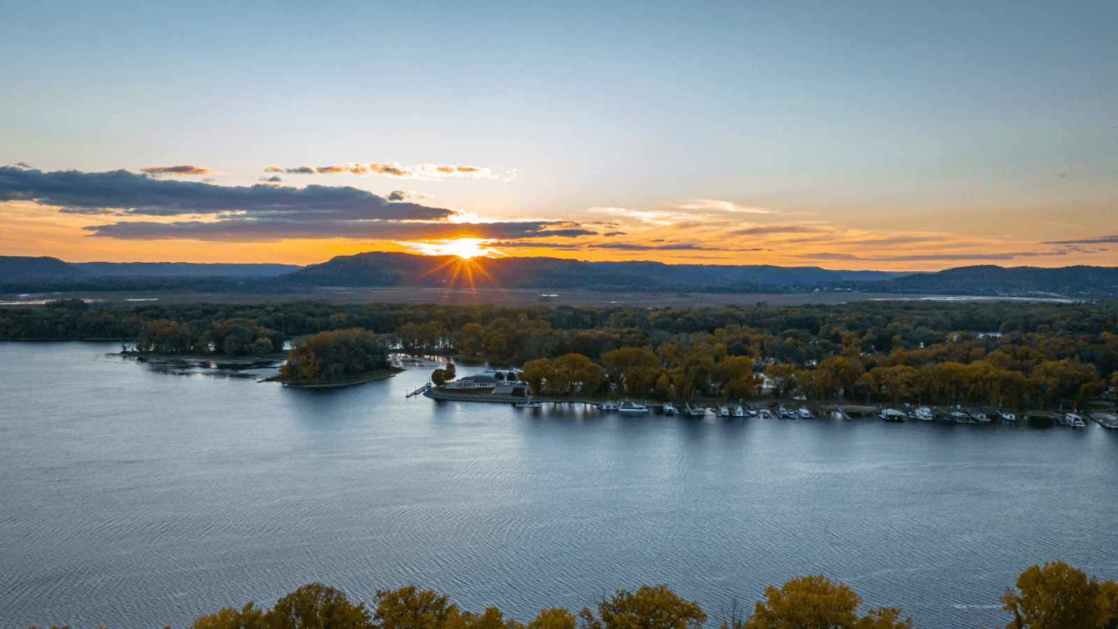 Member Directory fall view of the Mississippi river at sunset